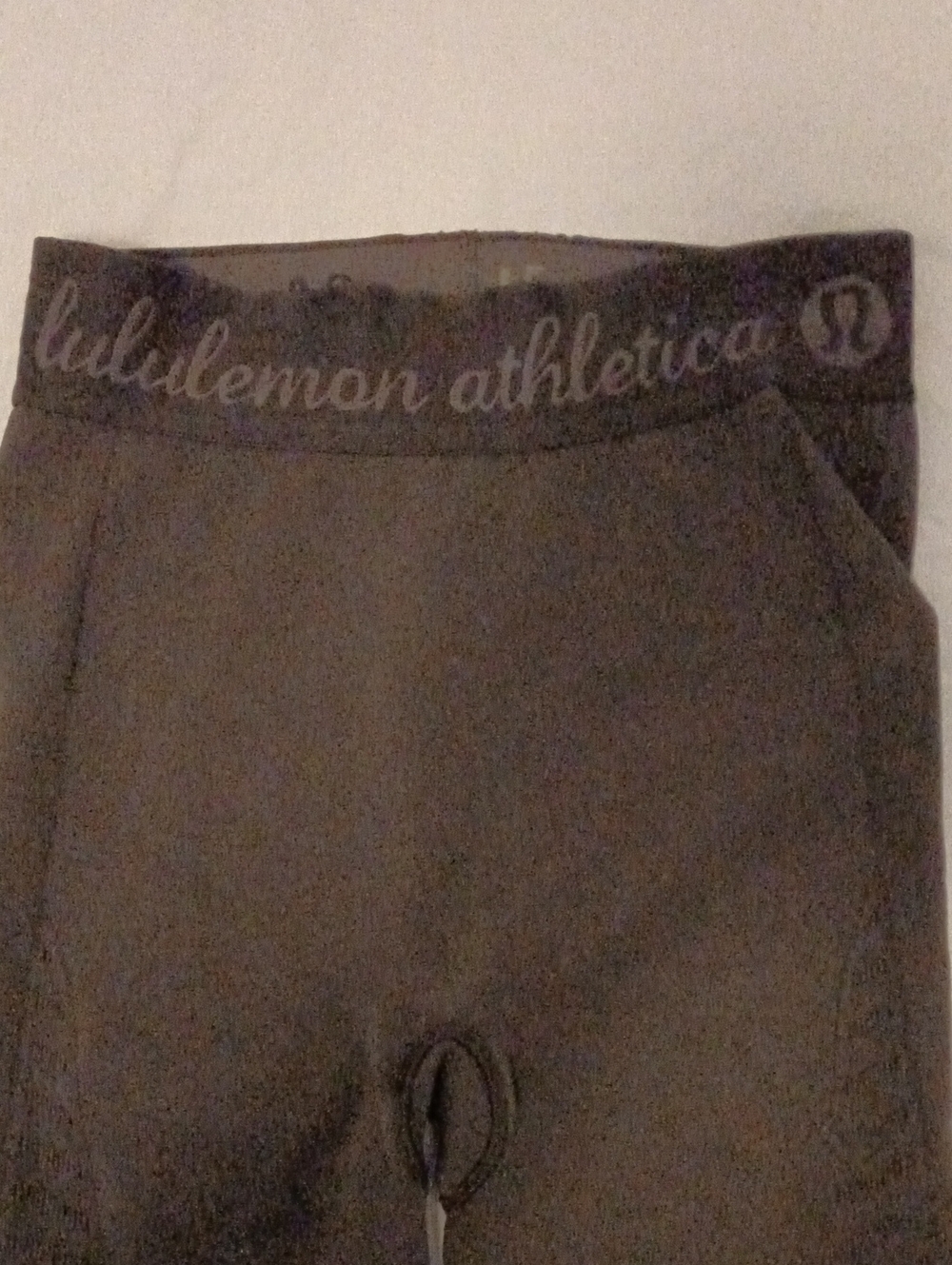 Lululemon Athletica Black Cursive Logo Waistband Leggings subtle pattern on legs